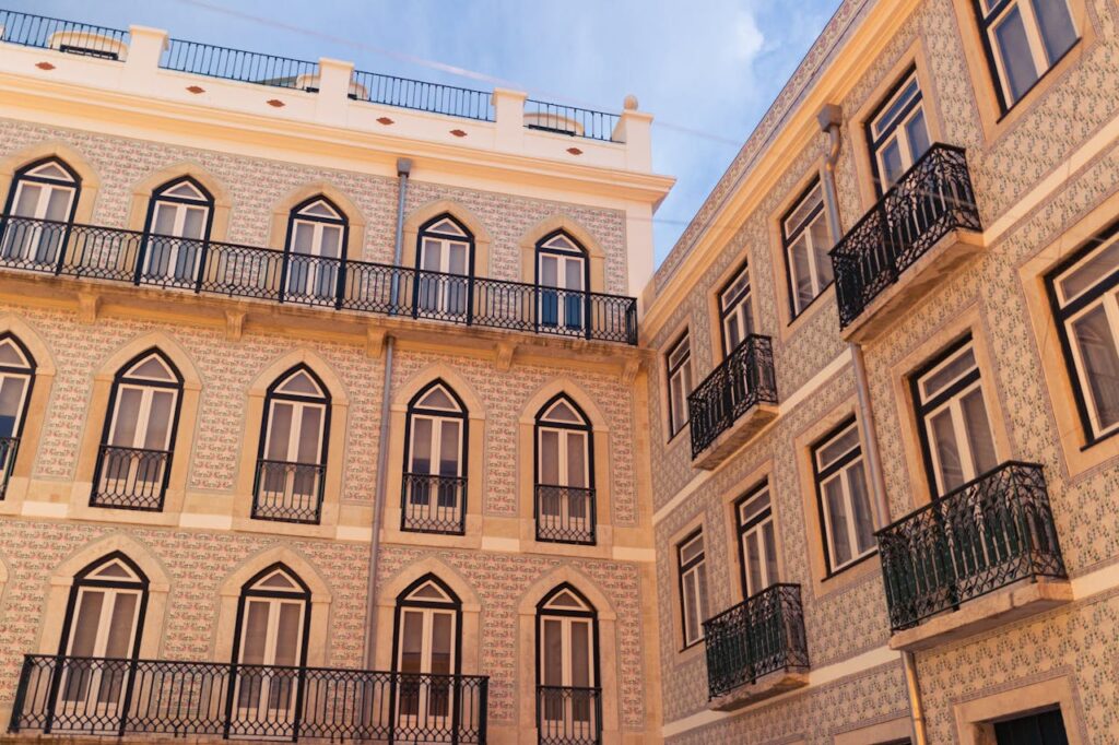 Elegant Lisbon building facade with traditional balconies in Portugal.